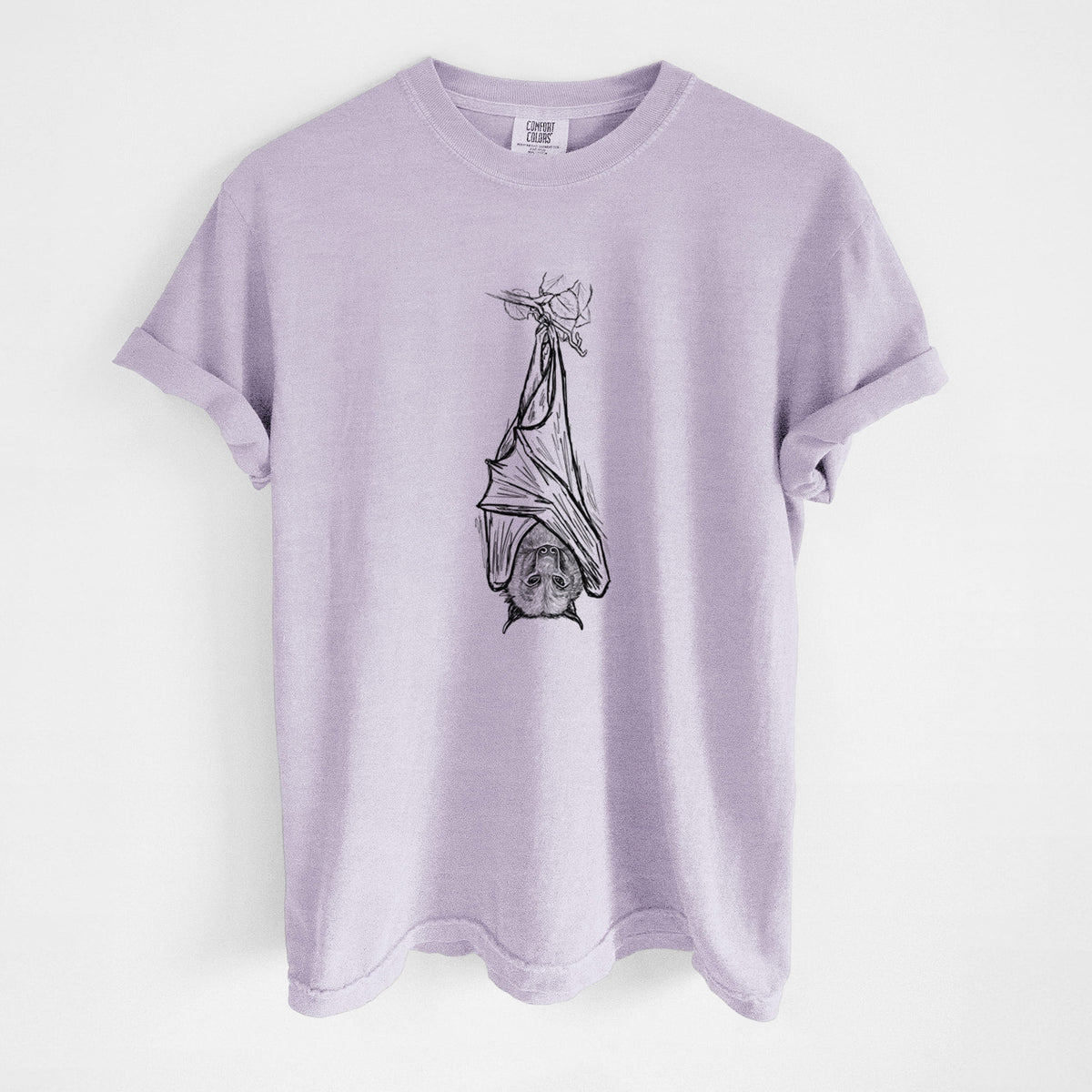 Orchid purple Comfort Colors t-shirt laid flat, printed with a black ink illustration of a large flying fox bat hanging upside down with its wings wrapped around it.