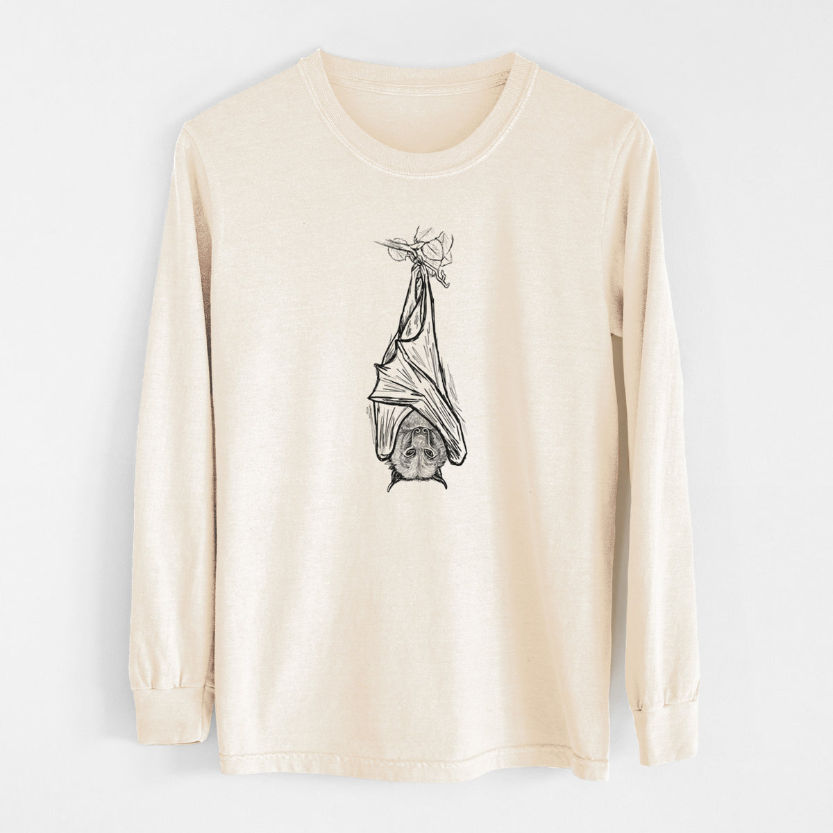 Ivory Comfort Colors long sleeve shirt laid flat, printed with a black ink illustration of a large flying fox bat hanging upside down with its wings wrapped around it.