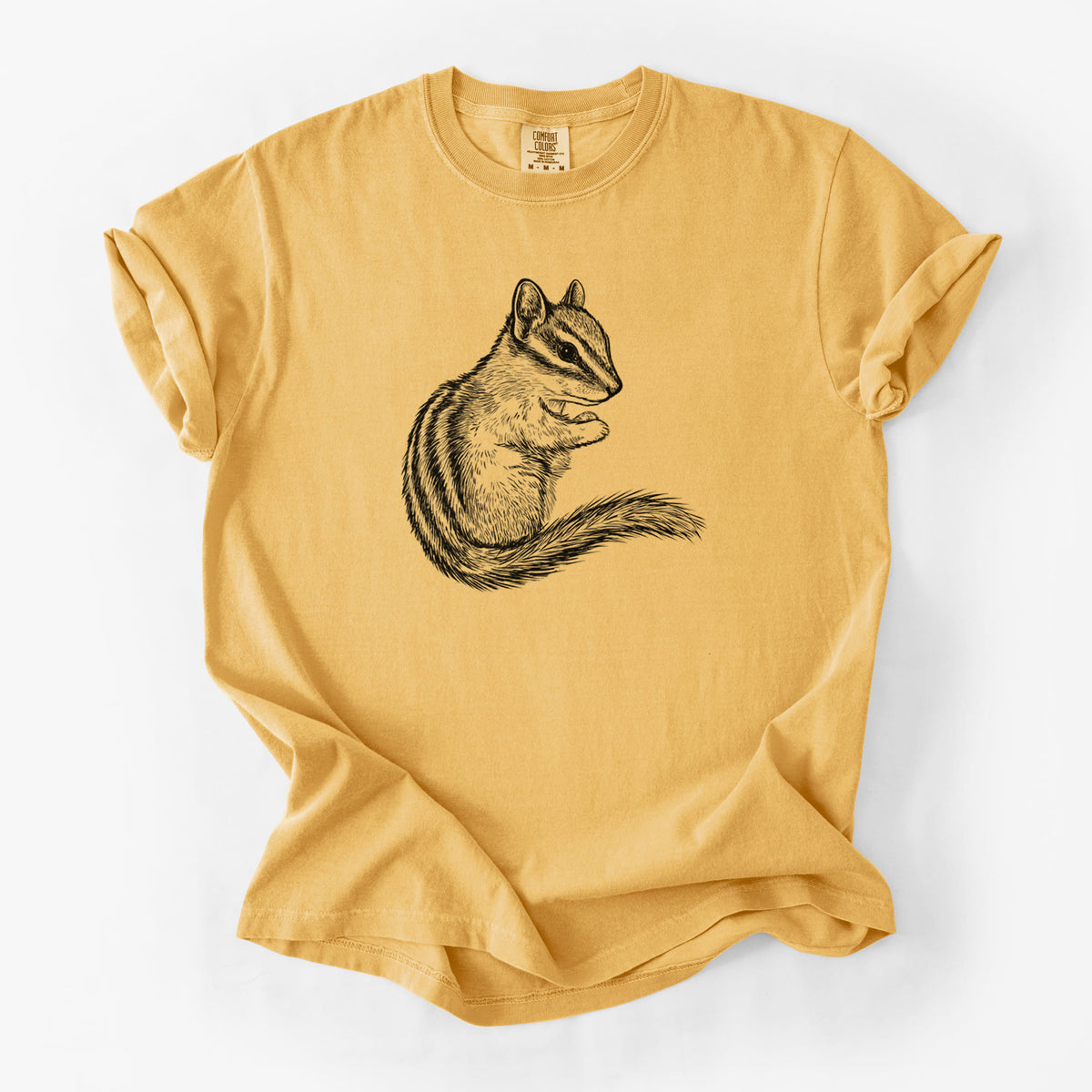 Golden wheat yellow Comfort Colors t-shirt laid flat, printed with a detailed black ink illustration of a least chipmunk sitting and holding food in its paws.