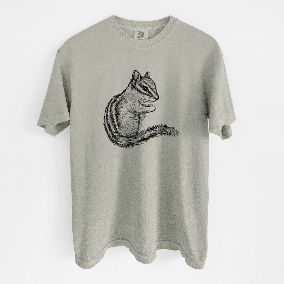 Sandstone beige Comfort Colors t-shirt laid flat, printed with a detailed black ink illustration of a least chipmunk sitting and holding food in its paws.