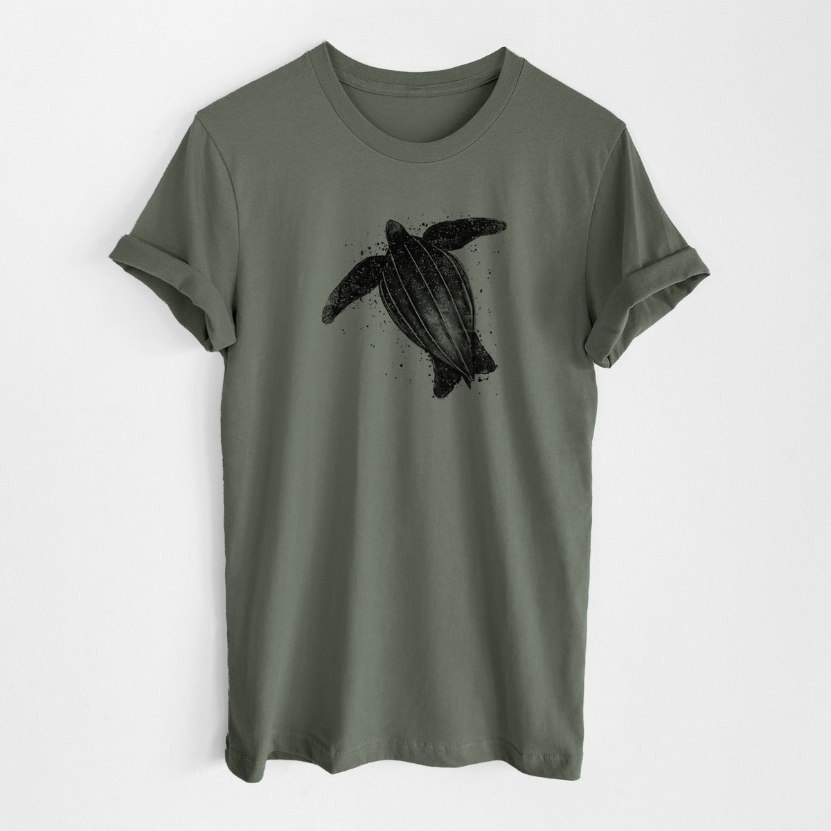 Military green lightweight cotton t-shirt laid flat, printed with a black ink illustration of a leatherback sea turtle swimming, with ink splatters.