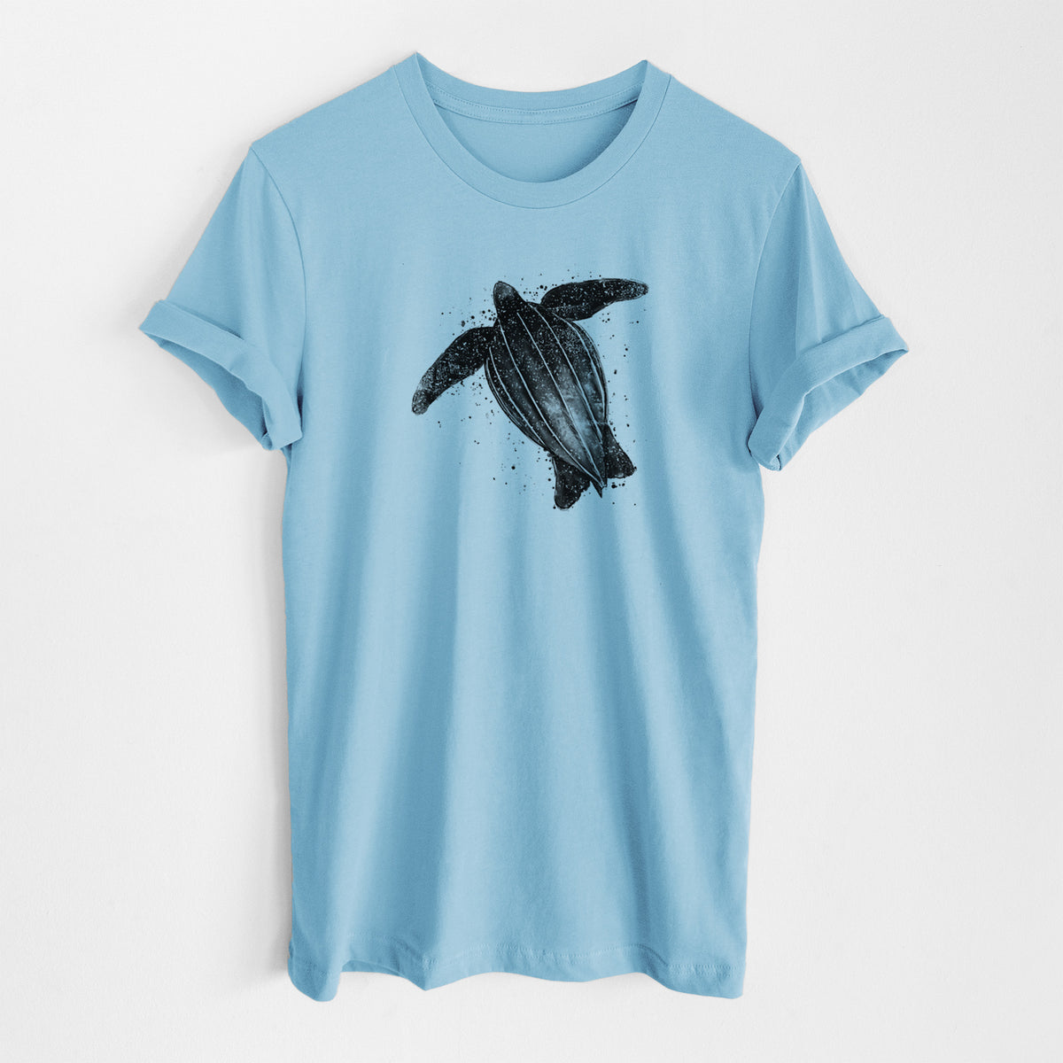 Ocean blue lightweight cotton t-shirt laid flat, printed with a black ink illustration of a leatherback sea turtle swimming, with ink splatters.