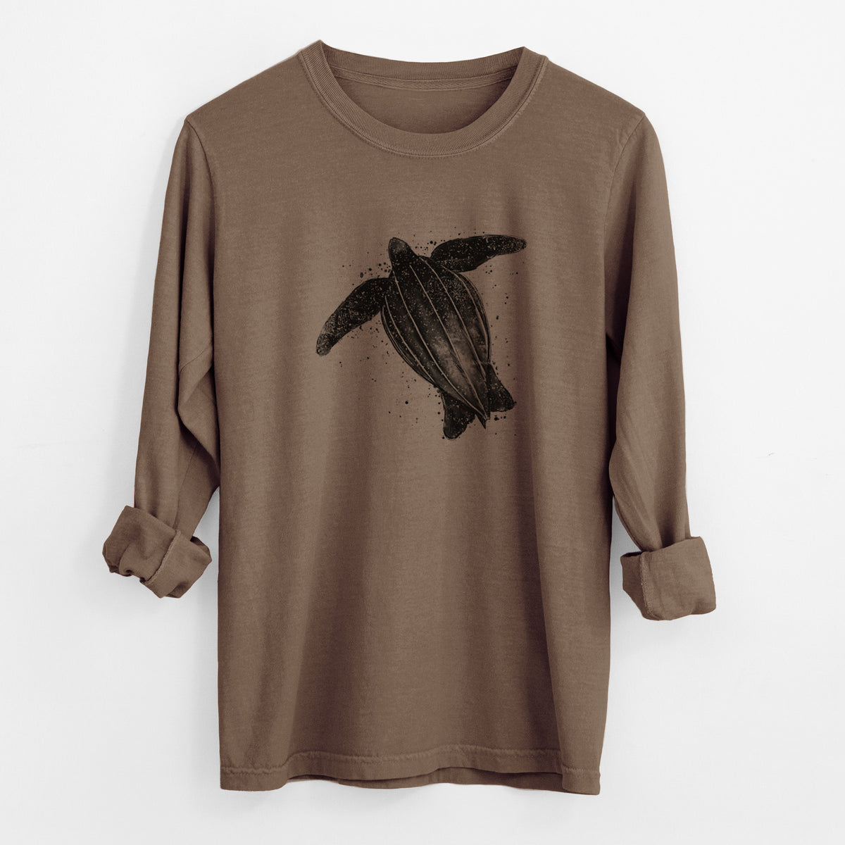 Espresso brown Comfort Colors long sleeve shirt laid flat with the cuffs rolled, printed with a black ink illustration of a leatherback sea turtle swimming, with ink splatters.