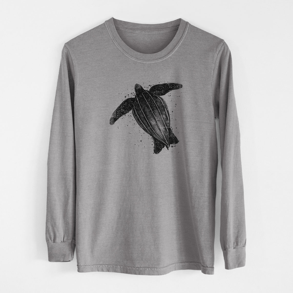 Grey Comfort Colors long sleeve shirt laid flat, printed with a black ink illustration of a leatherback sea turtle swimming, with ink splatters.