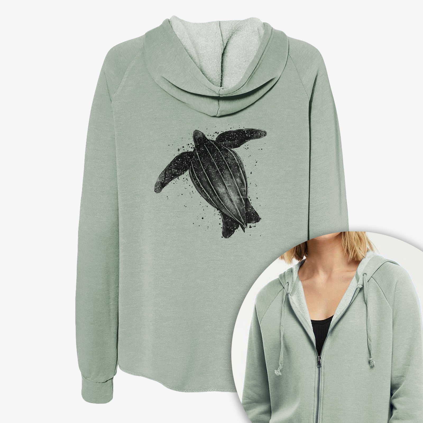 Women's Cali Wave zip-up sweatshirt printed with a black ink illustration of a leatherback sea turtle swimming, with ink splatters, with a close-up of the zipper.