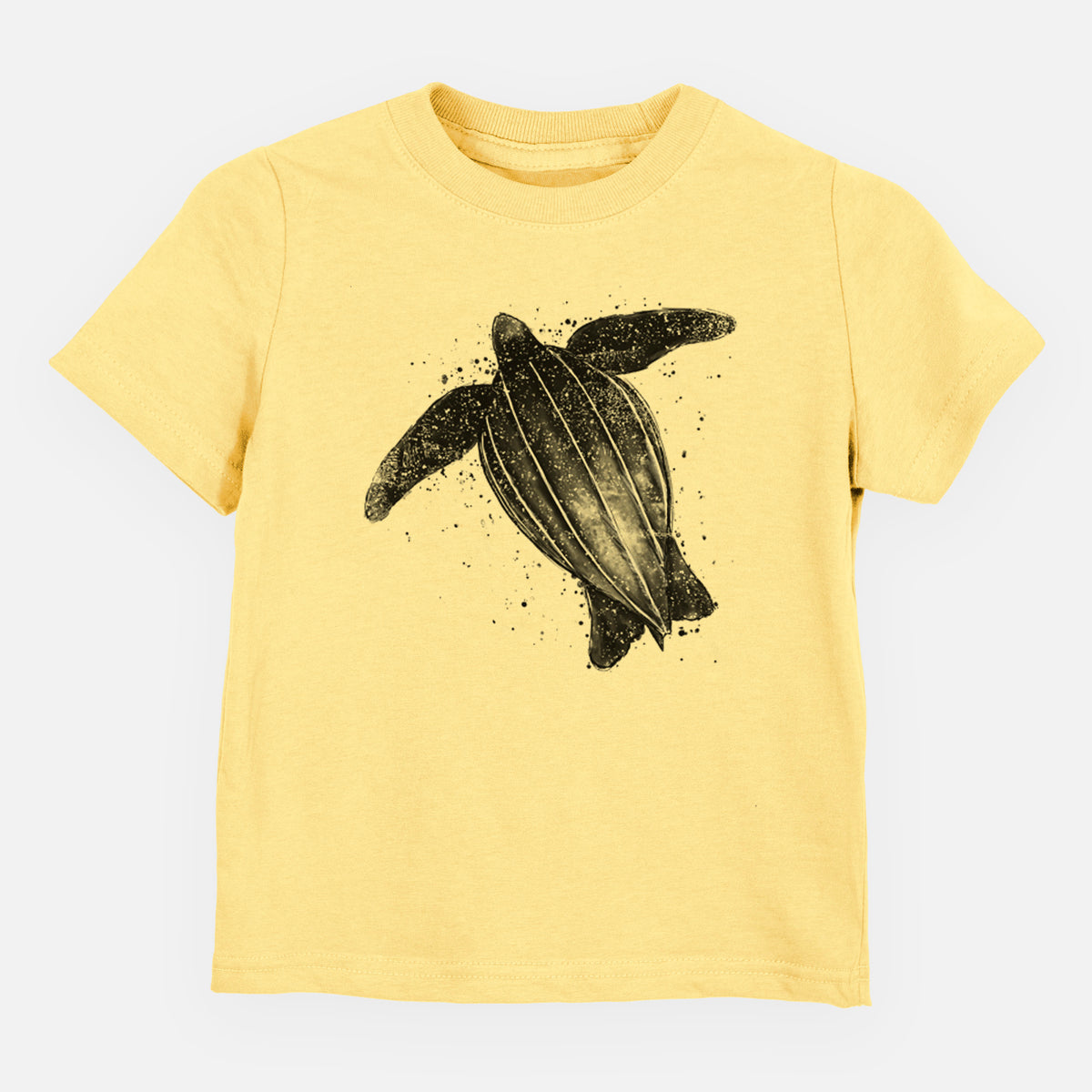 Butter yellow toddler t-shirt laid flat, printed with a black ink illustration of a leatherback sea turtle swimming, with ink splatters.