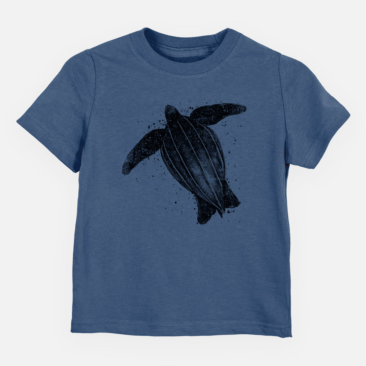 Indigo blue toddler t-shirt laid flat, printed with a black ink illustration of a leatherback sea turtle swimming, with ink splatters.