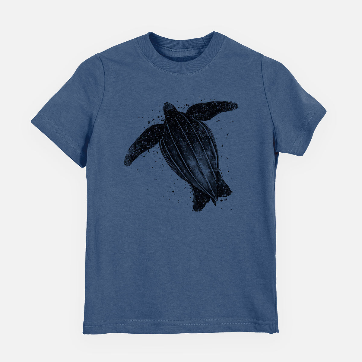 Indigo blue youth t-shirt laid flat, printed with a black ink illustration of a leatherback sea turtle swimming, with ink splatters.
