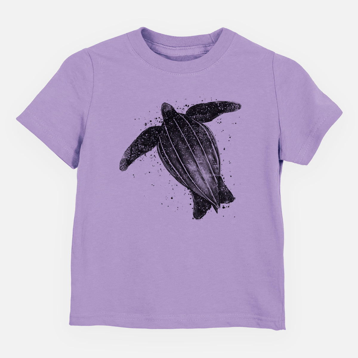 Lavender toddler t-shirt laid flat, printed with a black ink illustration of a leatherback sea turtle swimming, with ink splatters.