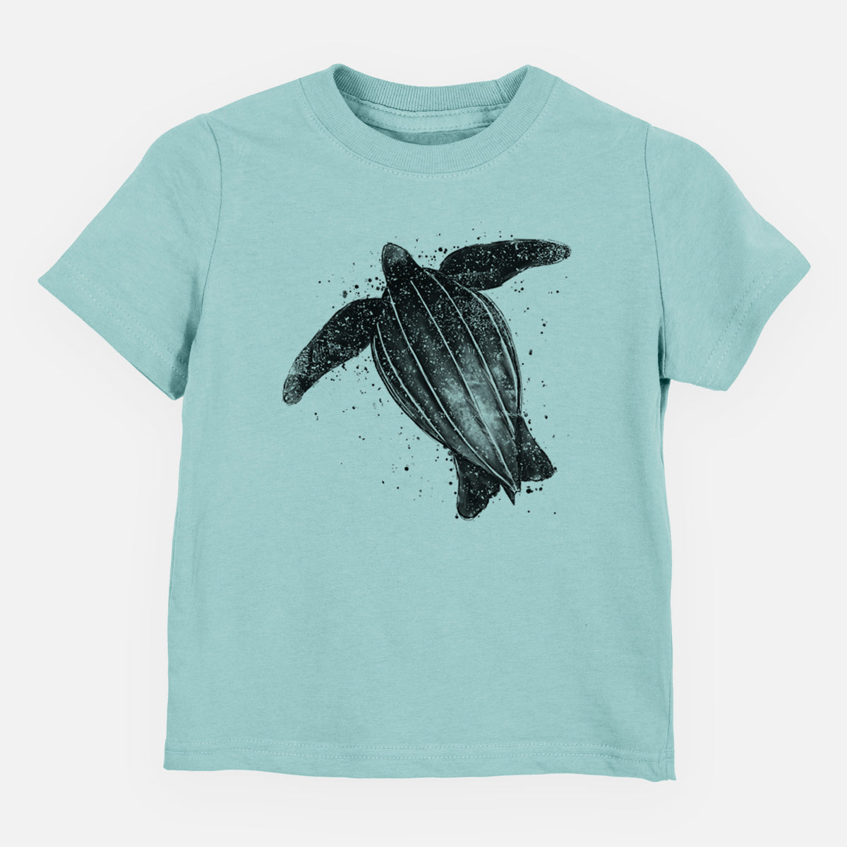 Saltwater toddler t-shirt laid flat, printed with a black ink illustration of a leatherback sea turtle swimming, with ink splatters.
