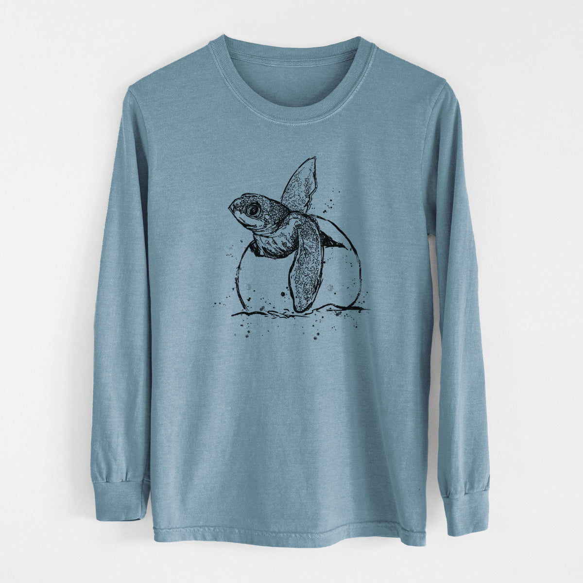 Steel blue Comfort Colors long sleeve shirt laid flat, printed with a black ink illustration of a leatherback sea turtle hatchling emerging from its egg.
