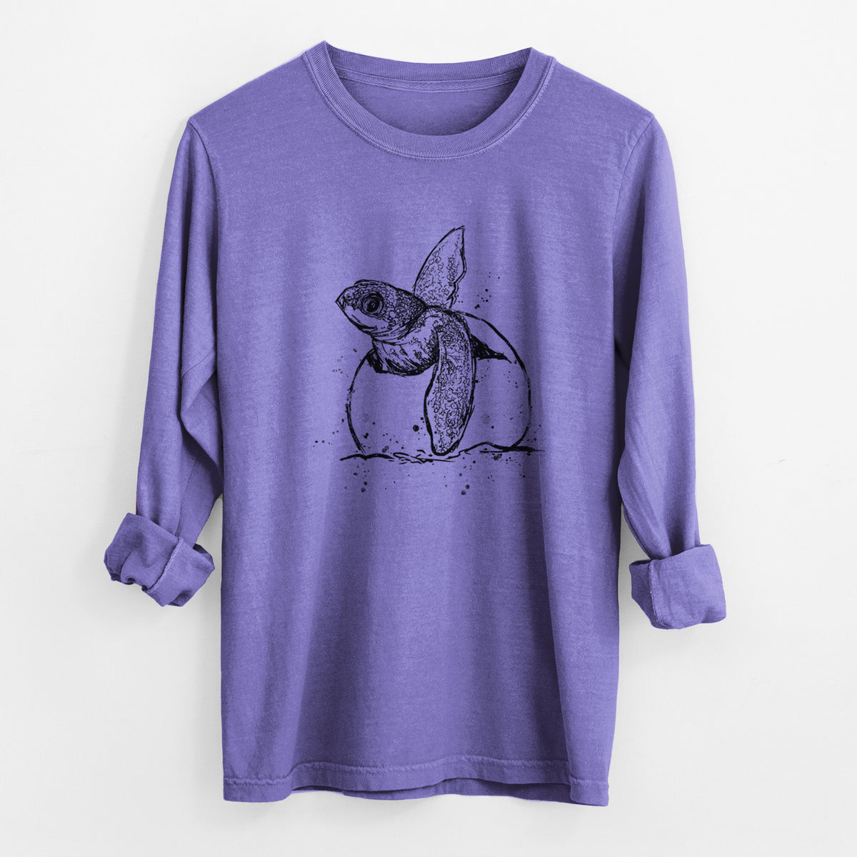 Violet purple Comfort Colors long sleeve shirt laid flat with the cuffs rolled, printed with a black ink illustration of a leatherback sea turtle hatchling emerging from its egg.