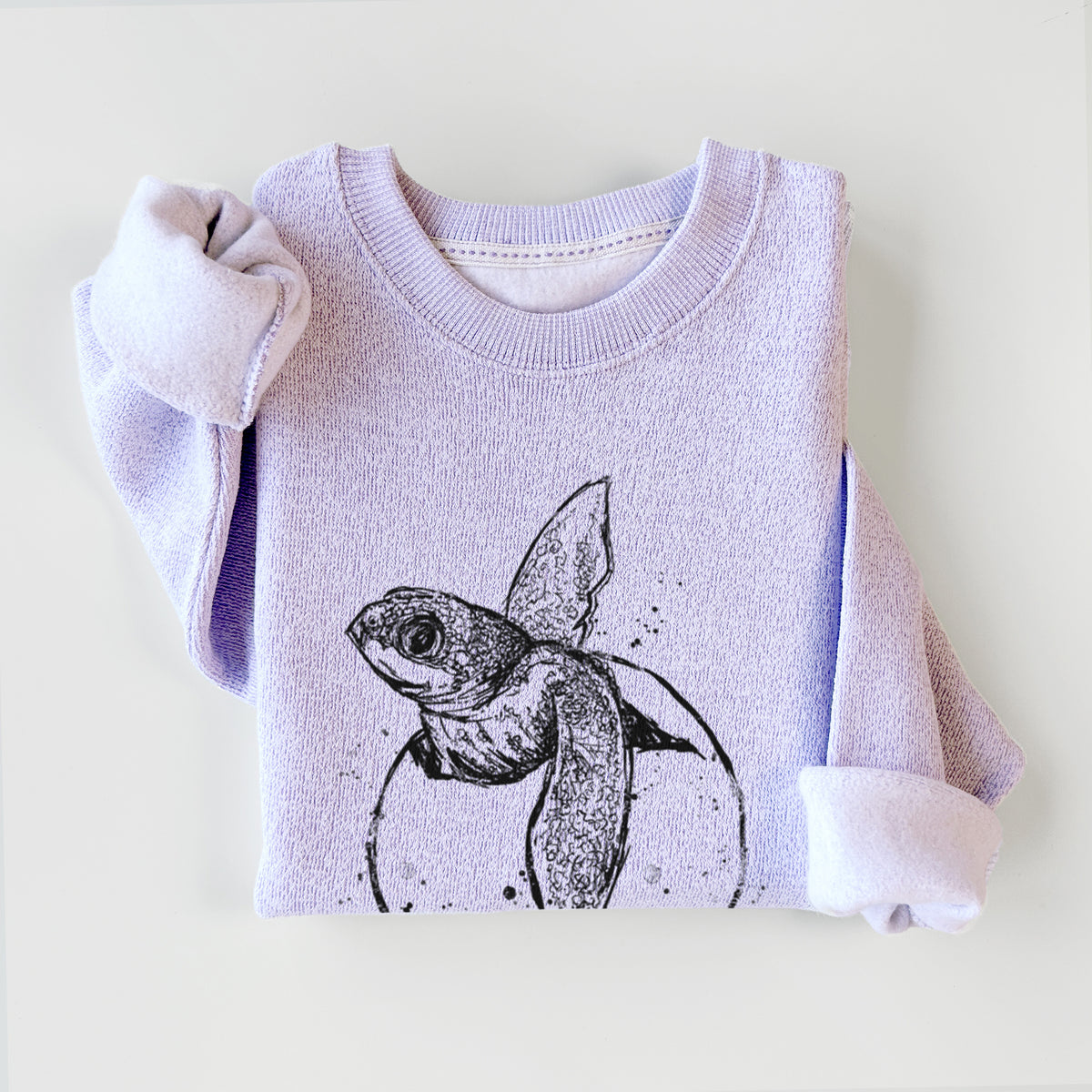Ice purple knit sweatshirt printed with a black ink illustration of a leatherback sea turtle hatchling emerging from its egg, styled flat.