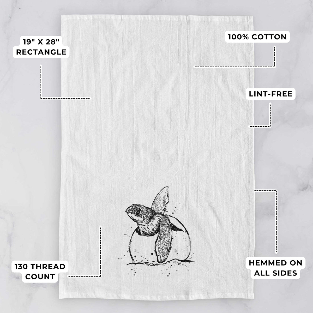 White tea towel printed with a black ink illustration of a leatherback sea turtle hatchling emerging from its egg, with feature labels: 19 by 28 inch rectangle, 100% cotton, lint-free, 130 thread count, hemmed on all sides.
