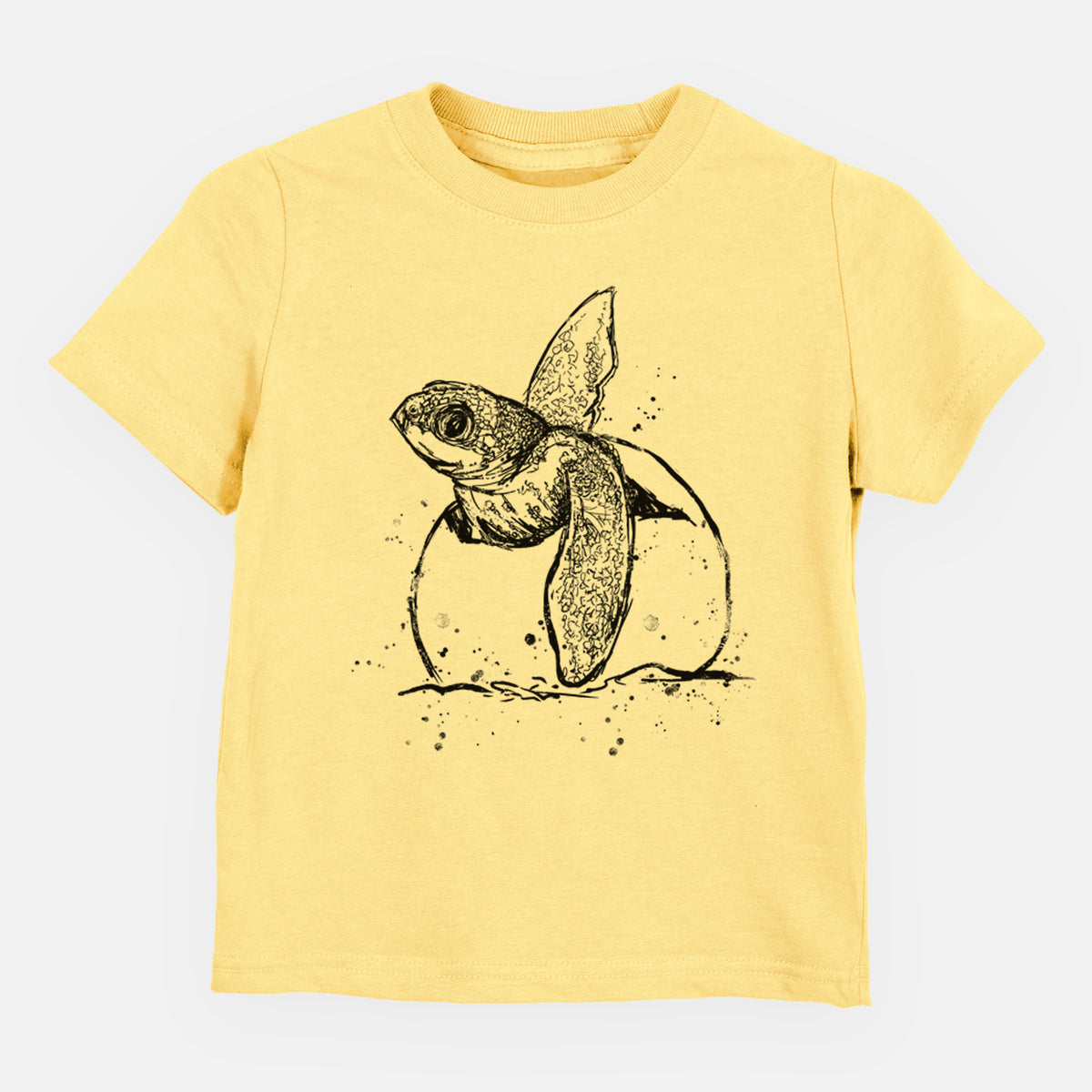 Butter yellow toddler t-shirt laid flat, printed with a black ink illustration of a leatherback sea turtle hatchling emerging from its egg.