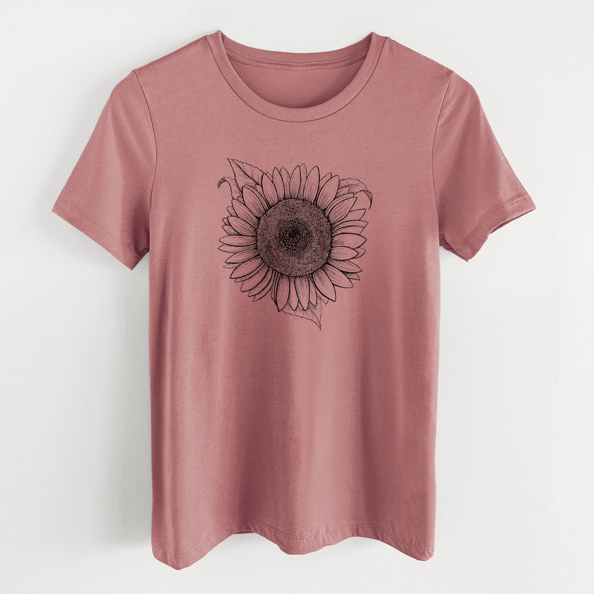 Mauve pink women's relaxed fit cotton t-shirt laid flat, printed with a detailed black ink line drawing of a Lemon Queen sunflower in bloom.