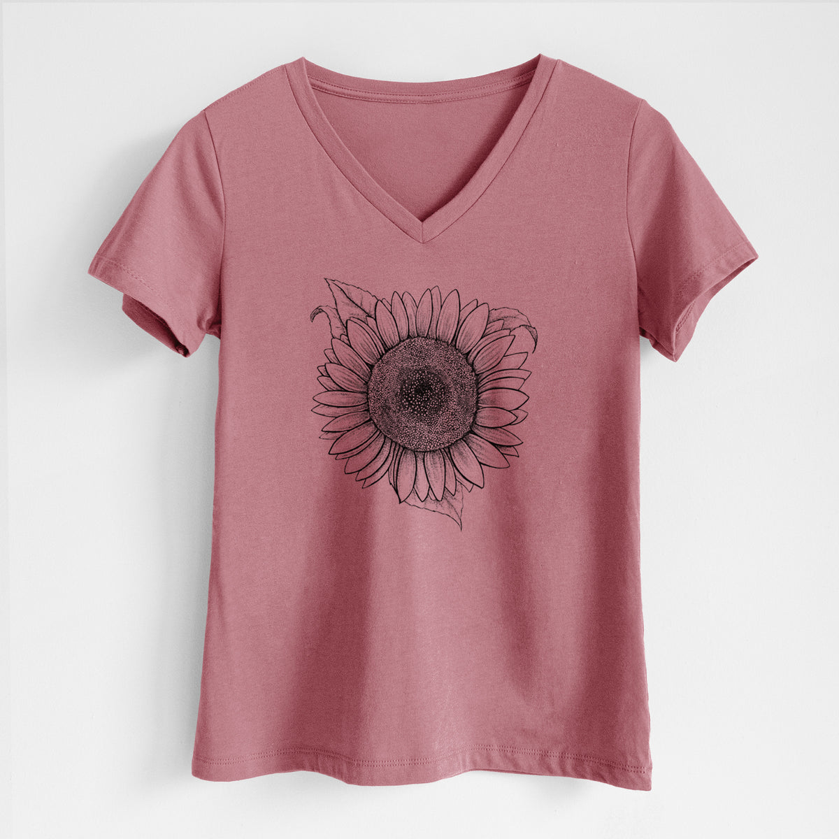 Mauve pink women's relaxed fit cotton V-neck t-shirt laid flat, printed with a detailed black ink line drawing of a Lemon Queen sunflower in bloom.