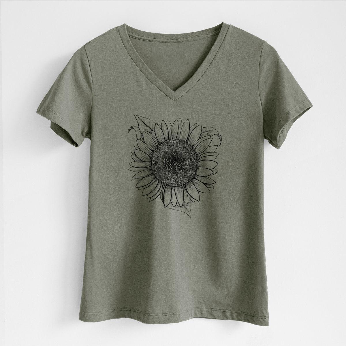 Military green women's relaxed fit cotton V-neck t-shirt laid flat, printed with a detailed black ink line drawing of a Lemon Queen sunflower in bloom.
