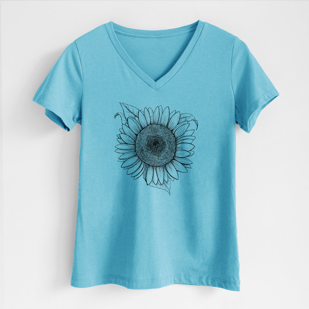 Turquoise women's relaxed fit cotton V-neck t-shirt laid flat, printed with a detailed black ink line drawing of a Lemon Queen sunflower in bloom.