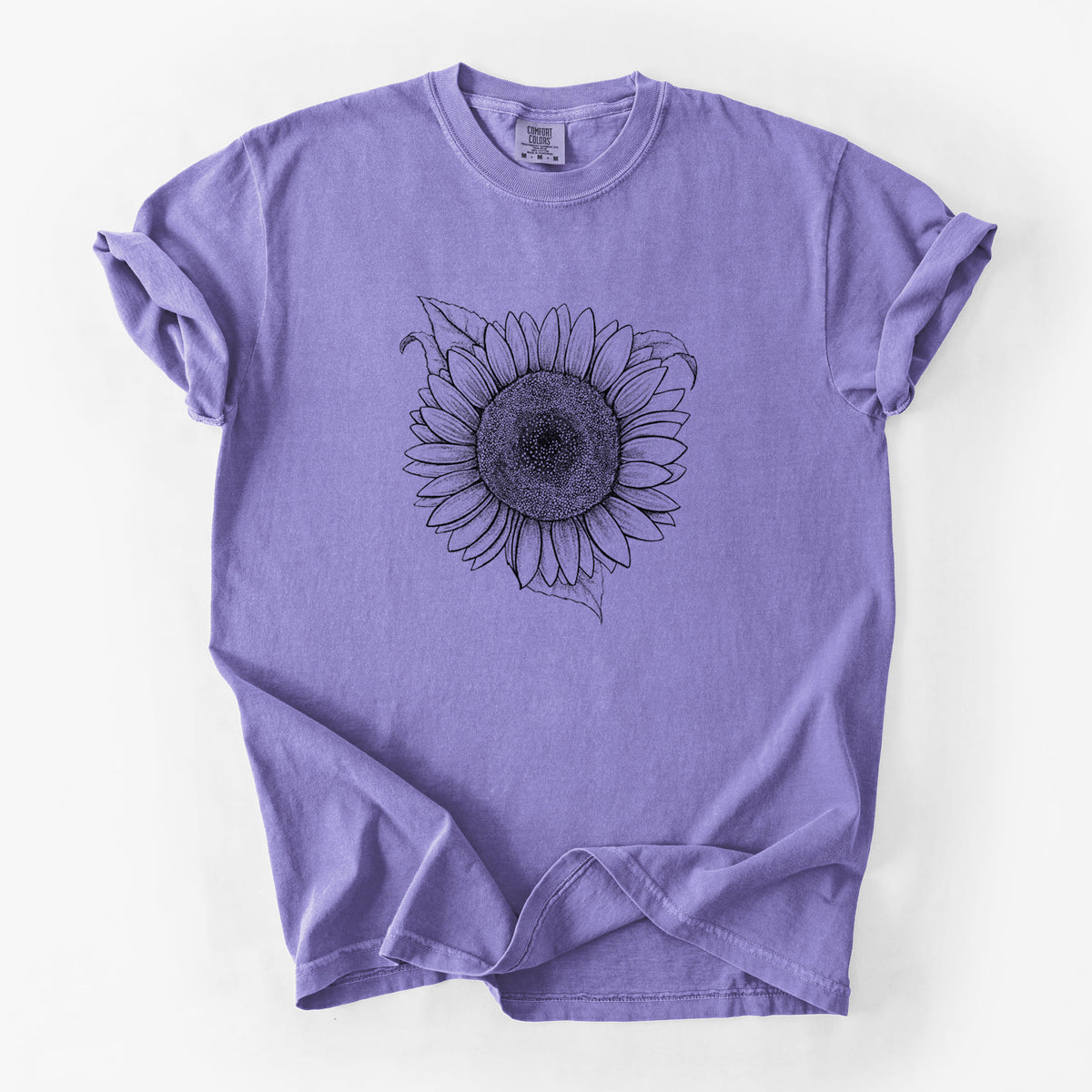 Violet purple Comfort Colors t-shirt laid flat, printed with a detailed black ink line drawing of a Lemon Queen sunflower in bloom.