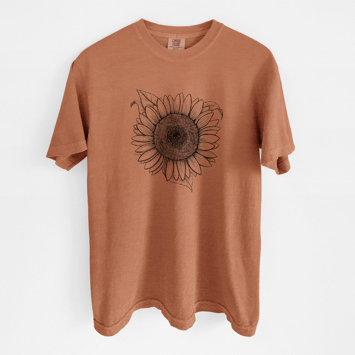 Yam burnt orange Comfort Colors t-shirt laid flat, printed with a detailed black ink line drawing of a Lemon Queen sunflower in bloom.