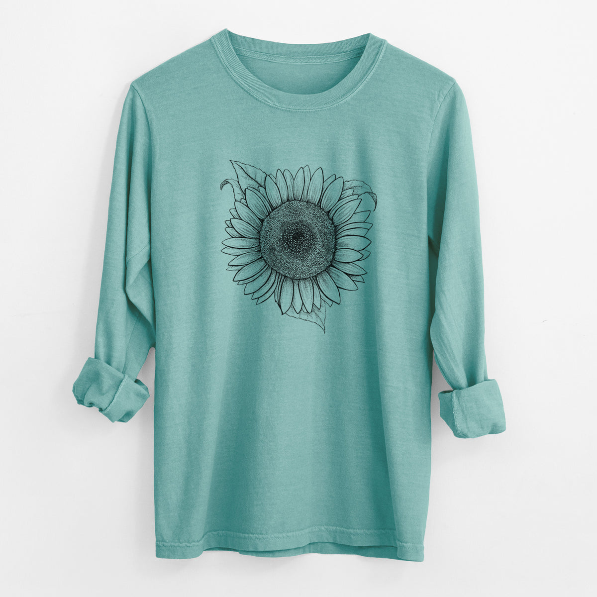 Reef green Comfort Colors long sleeve shirt laid flat with the cuffs rolled, printed with a detailed black ink line drawing of a Lemon Queen sunflower in bloom.
