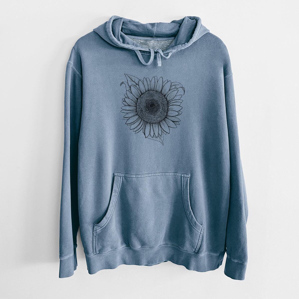 Slate blue pigment dyed hoodie laid flat, printed with a detailed black ink line drawing of a Lemon Queen sunflower in bloom.