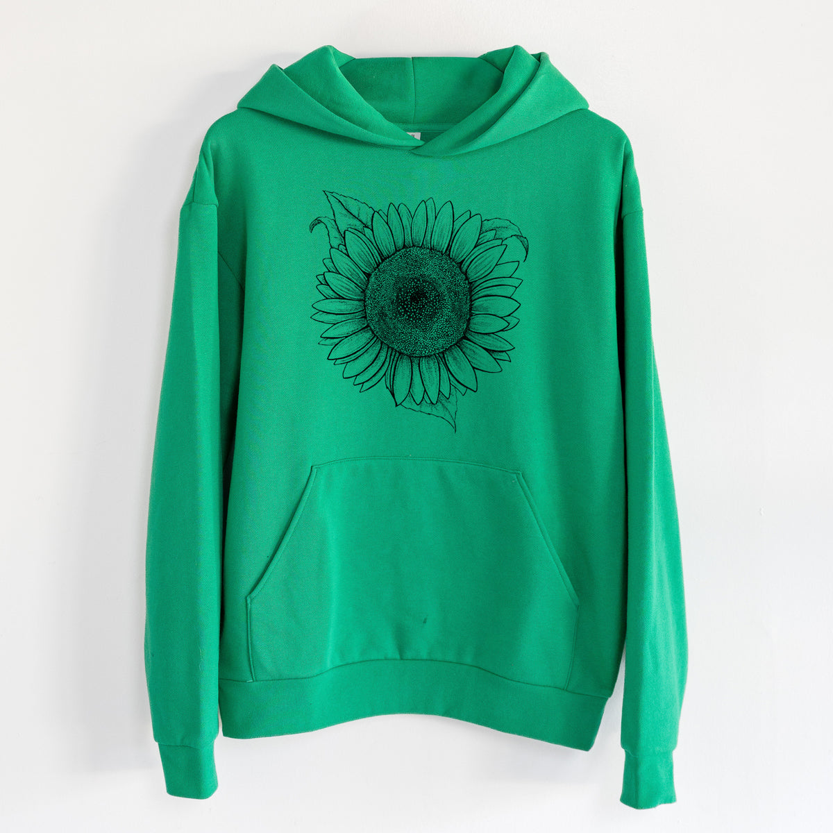 Lemon Queen Sunflower - Helianthus Annuus - Statement Midweight Hoodie in Kelly Green, hanging on a white wall, with a front kangaroo pocket and no drawcords.