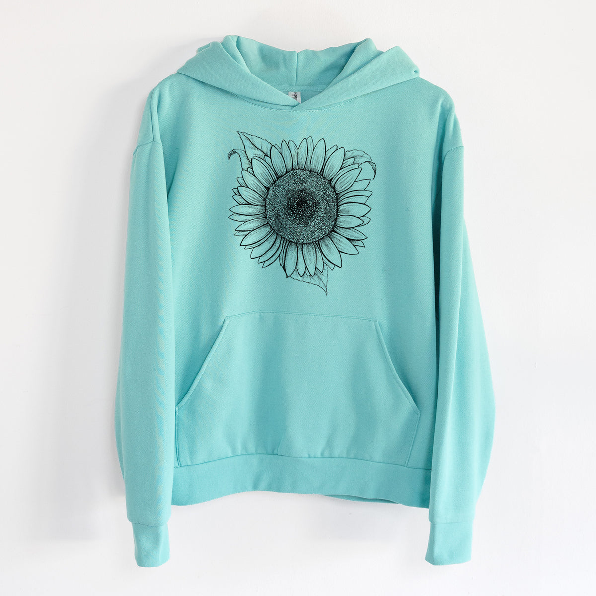 Lemon Queen Sunflower - Helianthus Annuus - Statement Midweight Hoodie in Seafoam, hanging on a white wall, with a front kangaroo pocket and no drawcords.