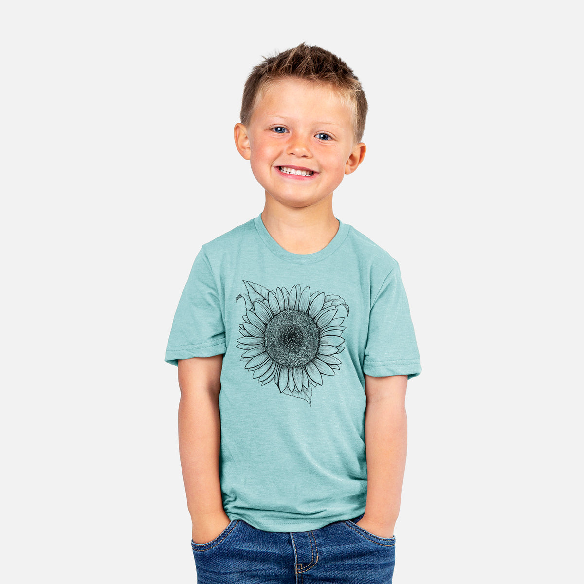 Smiling boy wearing a youth t-shirt printed with a detailed black ink line drawing of a Lemon Queen sunflower in bloom.