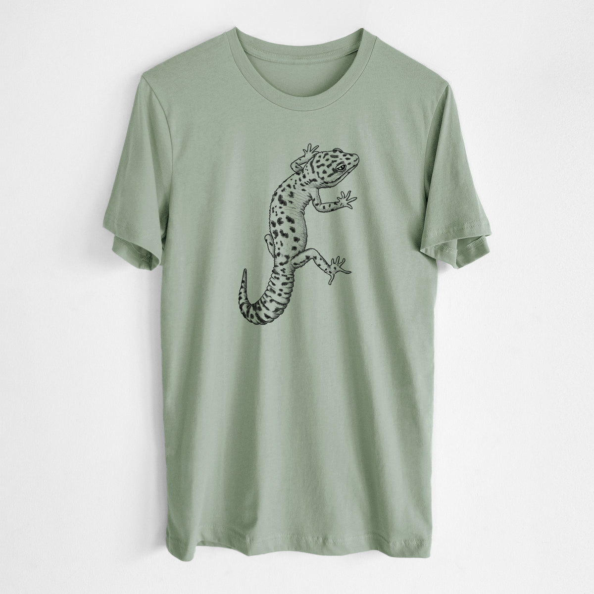 Sage green lightweight cotton t-shirt laid flat, printed with a detailed black ink illustration of a spotted leopard gecko climbing.