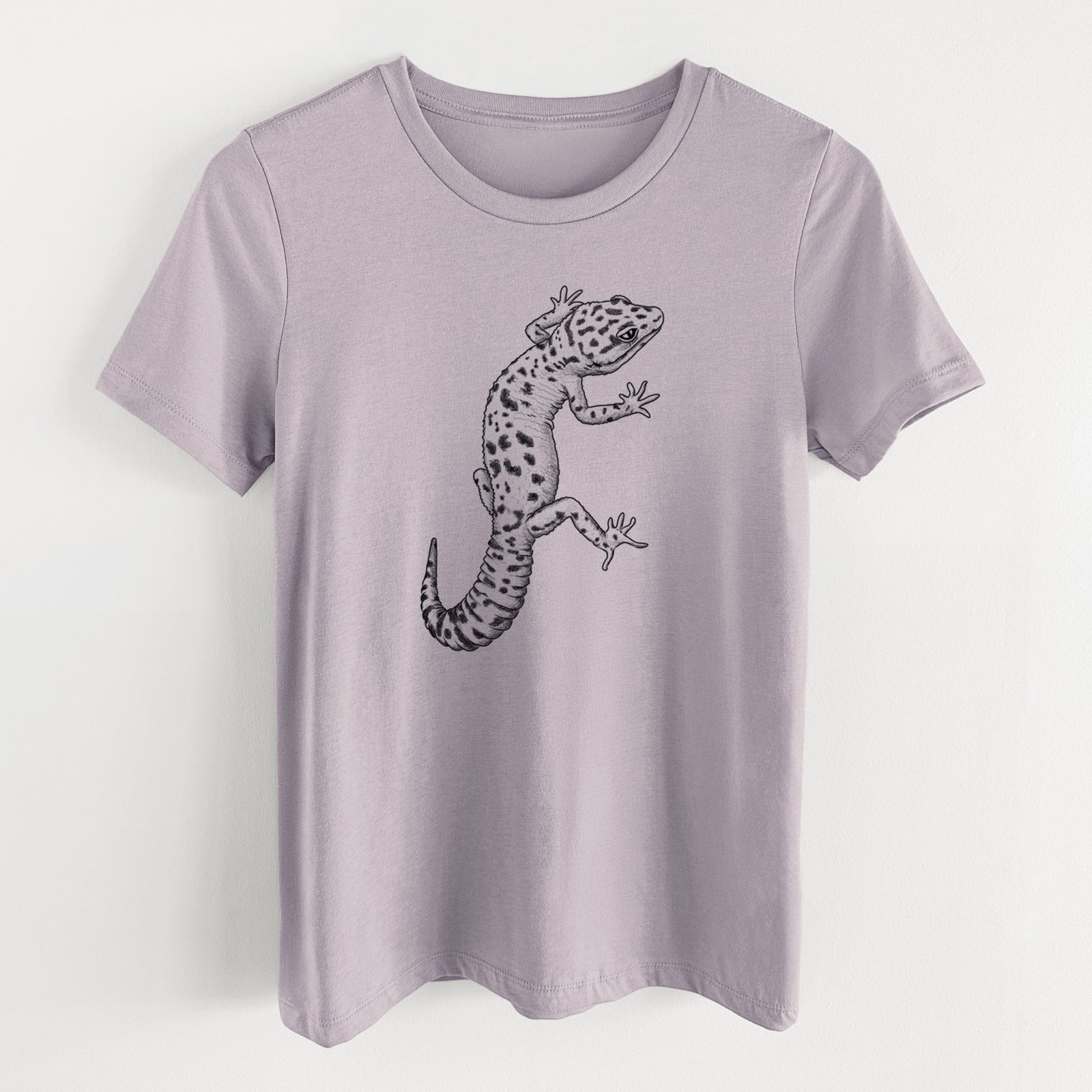 Light violet women's relaxed fit cotton t-shirt laid flat, printed with a detailed black ink illustration of a spotted leopard gecko climbing.