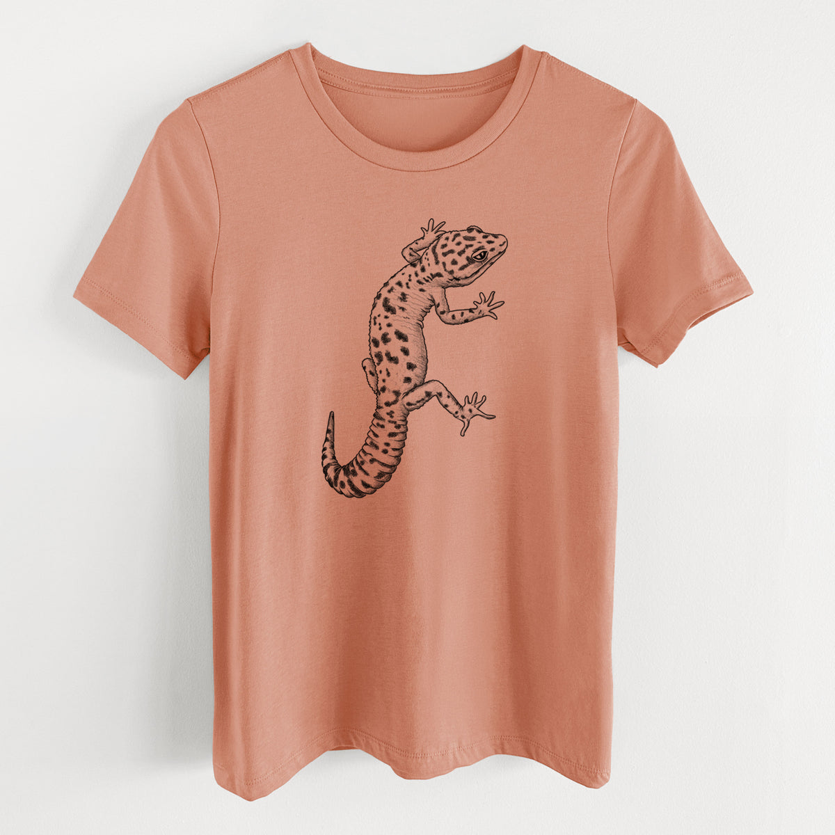 Terracotta orange women's relaxed fit cotton t-shirt laid flat, printed with a detailed black ink illustration of a spotted leopard gecko climbing.