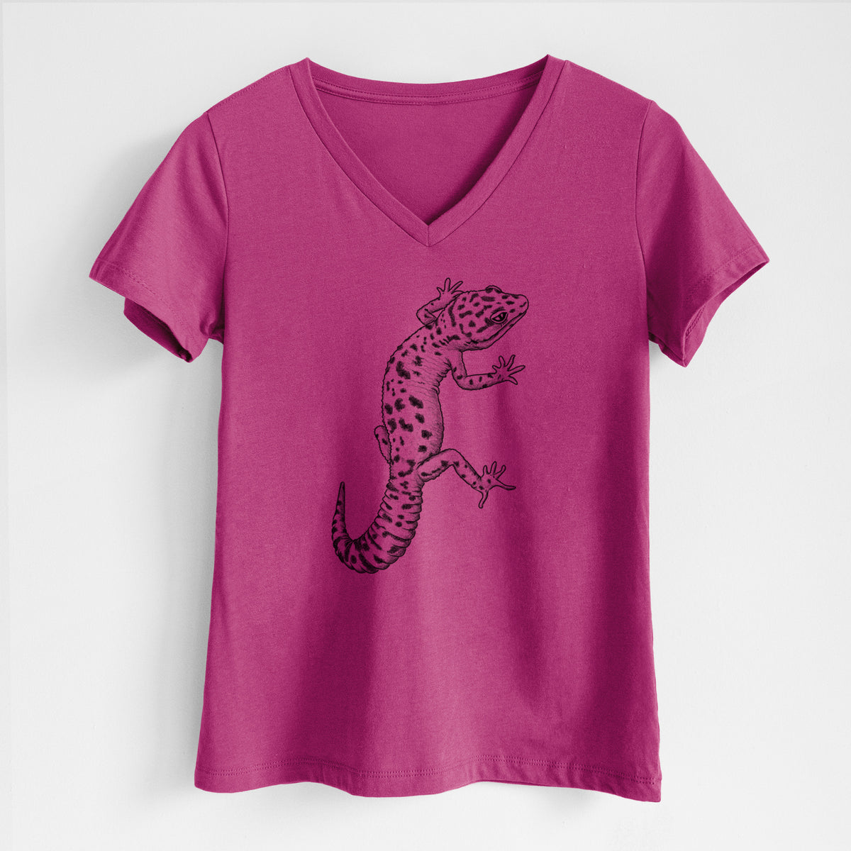 Berry pink women's relaxed fit cotton V-neck t-shirt laid flat, printed with a detailed black ink illustration of a spotted leopard gecko climbing.