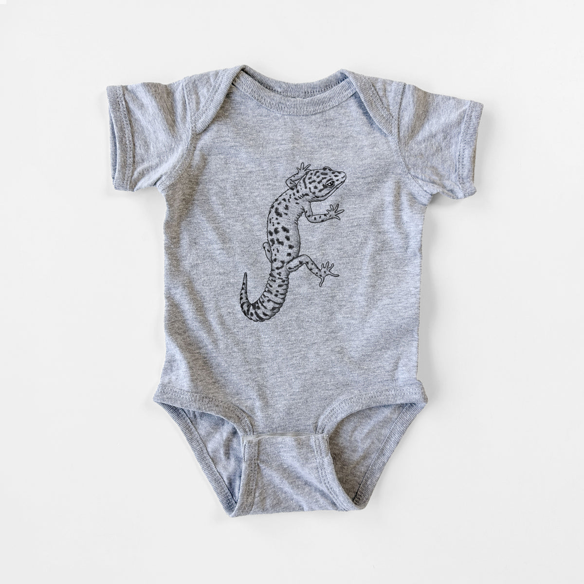 Grey baby bodysuit laid flat, printed with a detailed black ink illustration of a spotted leopard gecko climbing.