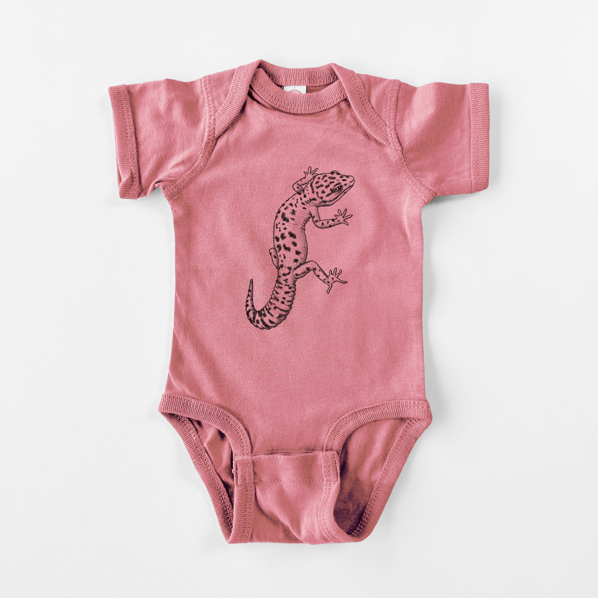 Mauve pink baby bodysuit laid flat, printed with a detailed black ink illustration of a spotted leopard gecko climbing.