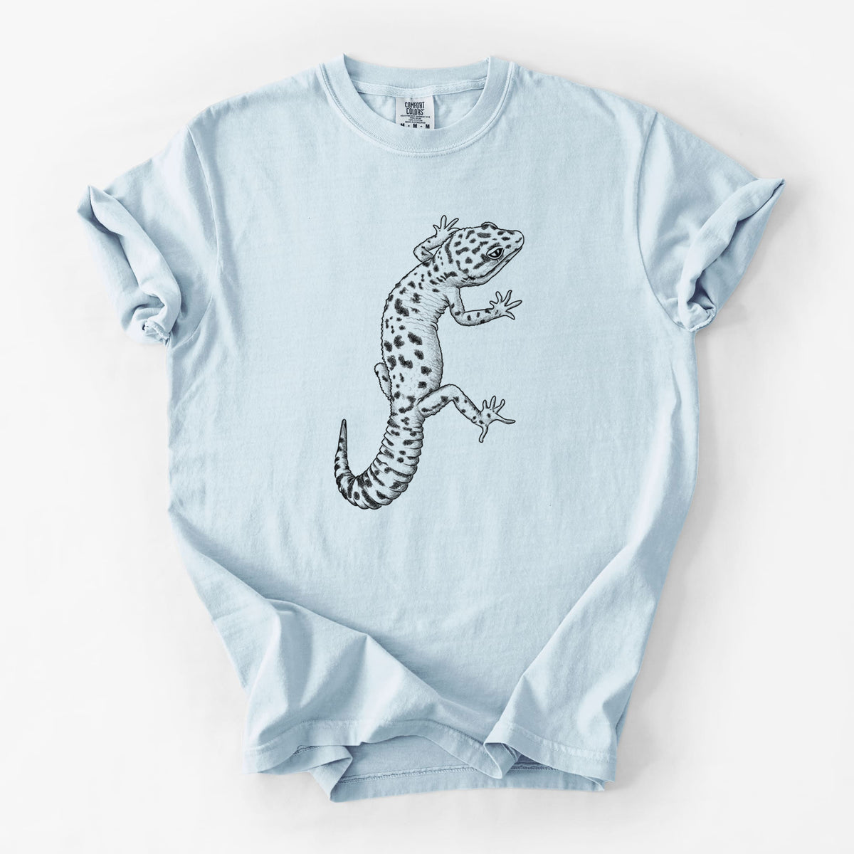 Chambray blue Comfort Colors t-shirt laid flat, printed with a detailed black ink illustration of a spotted leopard gecko climbing.