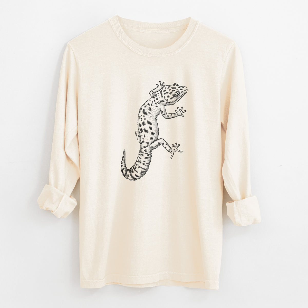 Ivory Comfort Colors long sleeve shirt laid flat with the cuffs rolled, printed with a detailed black ink illustration of a spotted leopard gecko climbing.