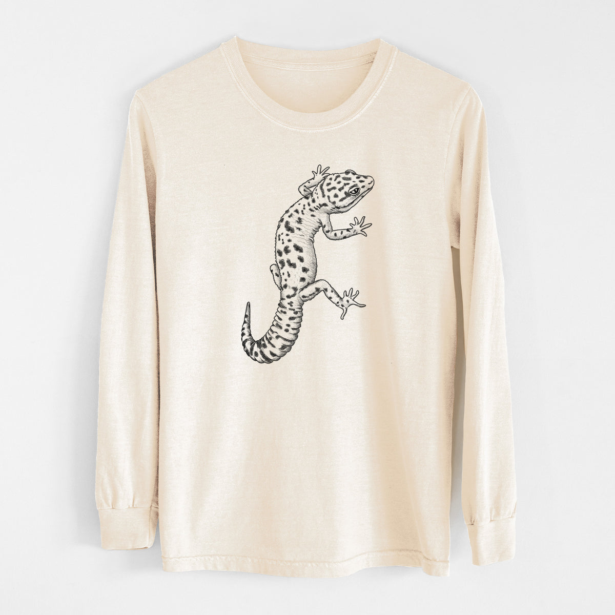 Ivory Comfort Colors long sleeve shirt laid flat, printed with a detailed black ink illustration of a spotted leopard gecko climbing.