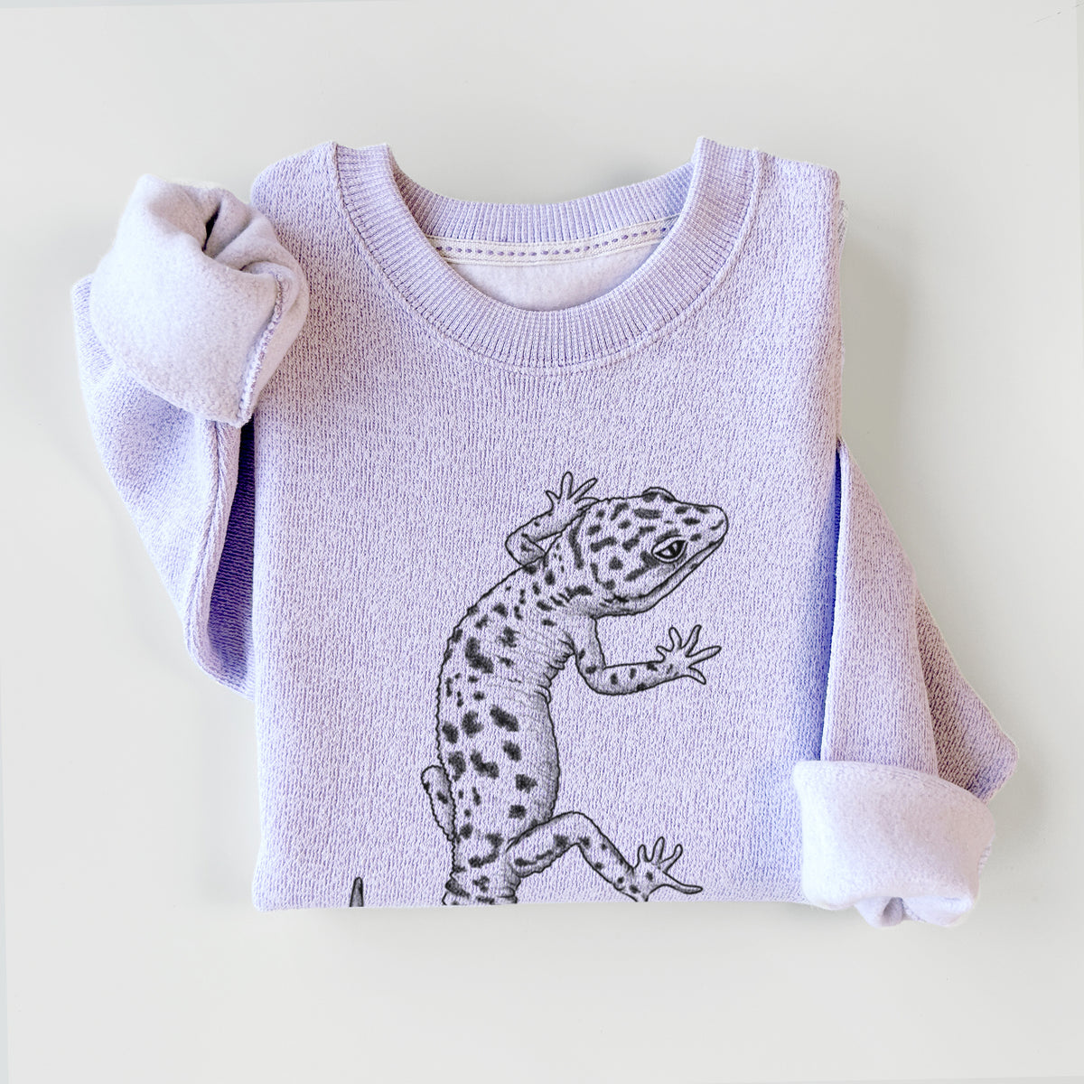Ice purple knit sweatshirt printed with a detailed black ink illustration of a spotted leopard gecko climbing, styled flat.