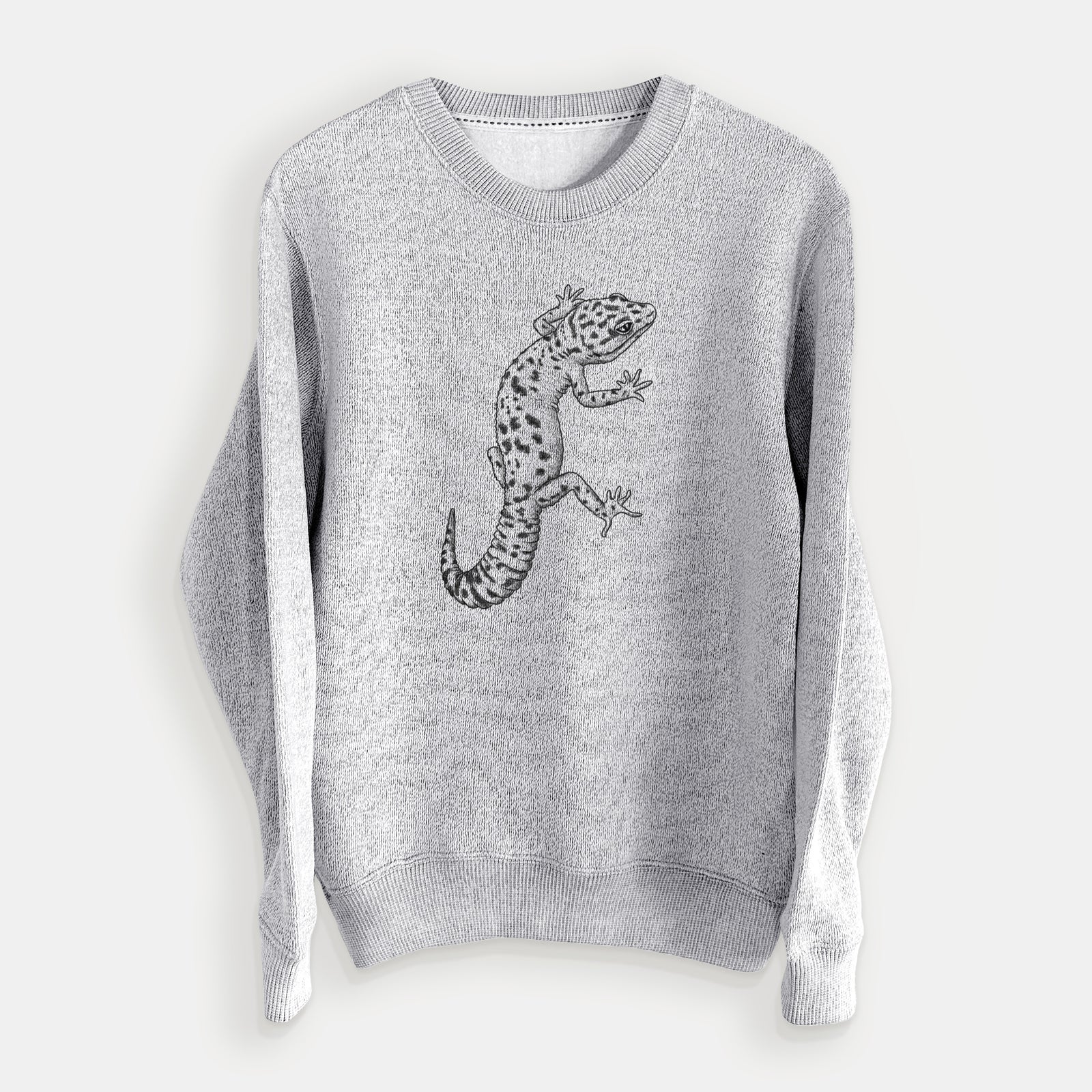 Salt and pepper knit sweatshirt laid flat, printed with a detailed black ink illustration of a spotted leopard gecko climbing.