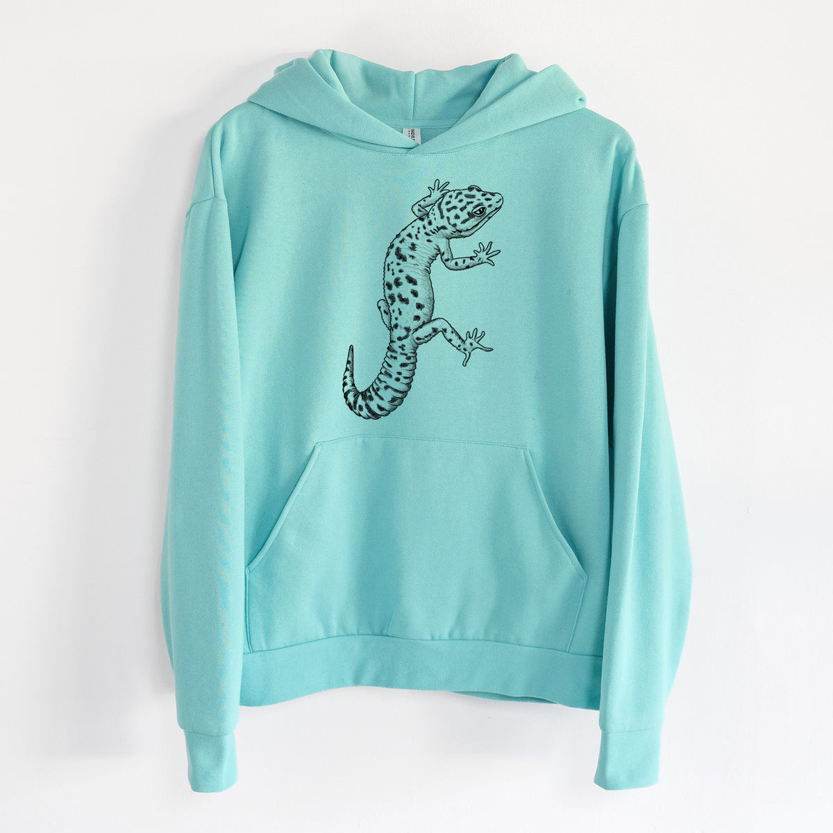 Eublepharis macularius - Leopard Gecko - Statement Midweight Hoodie in Seafoam, hanging on a white wall, with a front kangaroo pocket and no drawcords.