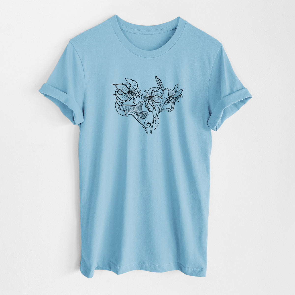 Ocean blue lightweight cotton t-shirt laid flat, printed with a black ink line drawing of lilies and a hummingbird arranged in a heart shape.