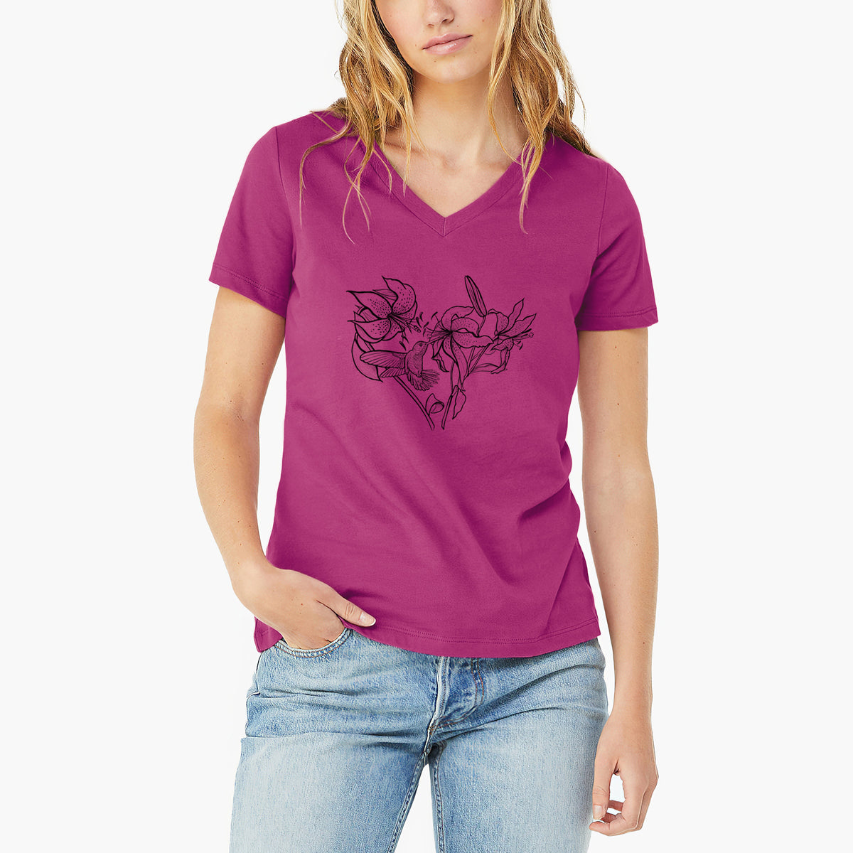 Woman wearing a berry pink women's relaxed fit cotton V-neck t-shirt printed with a black ink line drawing of lilies and a hummingbird arranged in a heart shape.