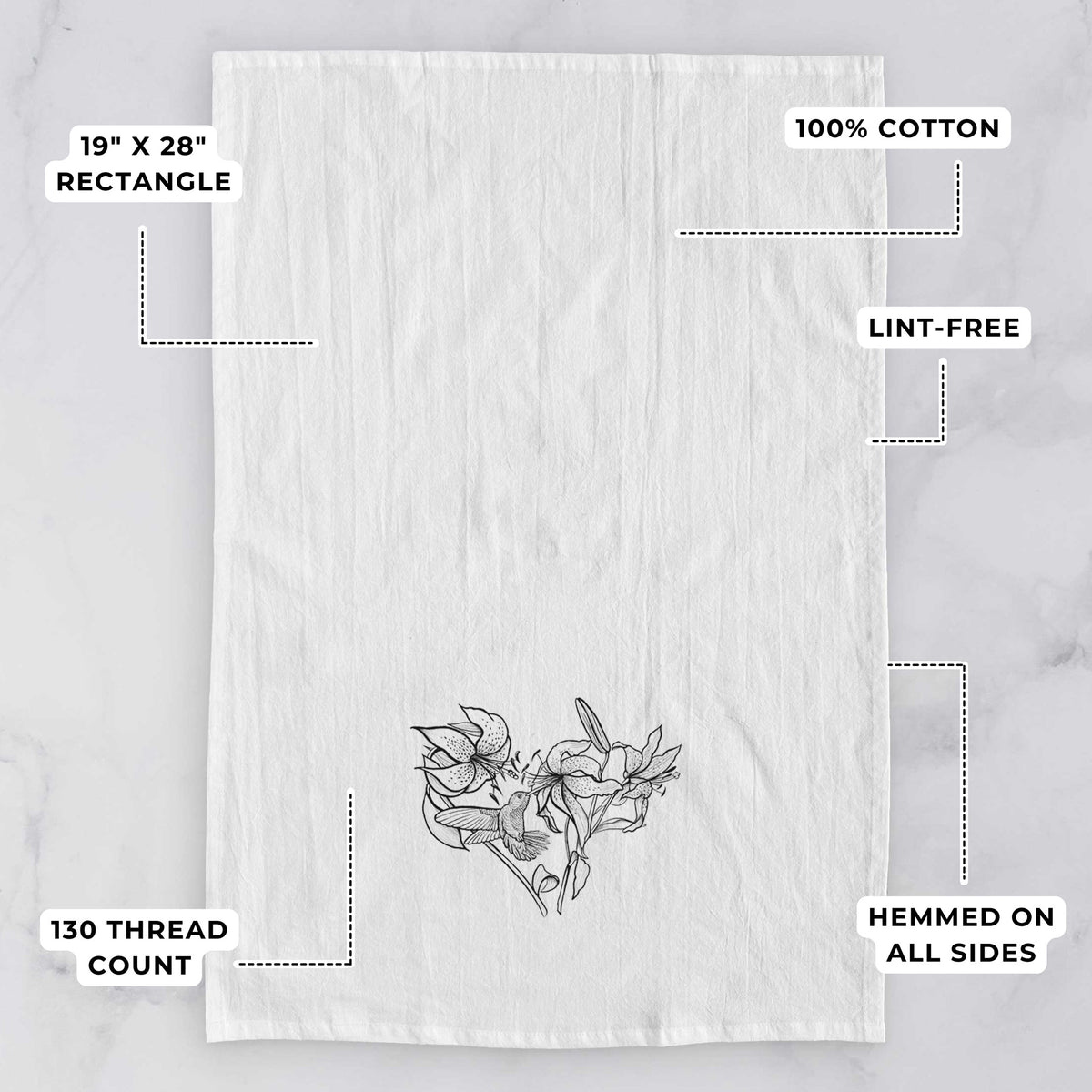 White tea towel printed with a black ink line drawing of lilies and a hummingbird arranged in a heart shape, with feature labels: 19 by 28 inch rectangle, 100% cotton, lint-free, 130 thread count, hemmed on all sides.