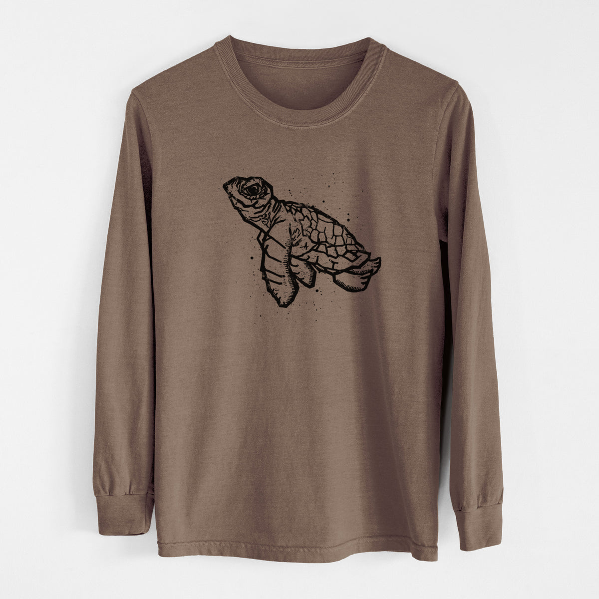 Espresso brown Comfort Colors long sleeve shirt laid flat, printed with a black linocut-style illustration of a baby sea turtle with a patterned shell and ink splatters.