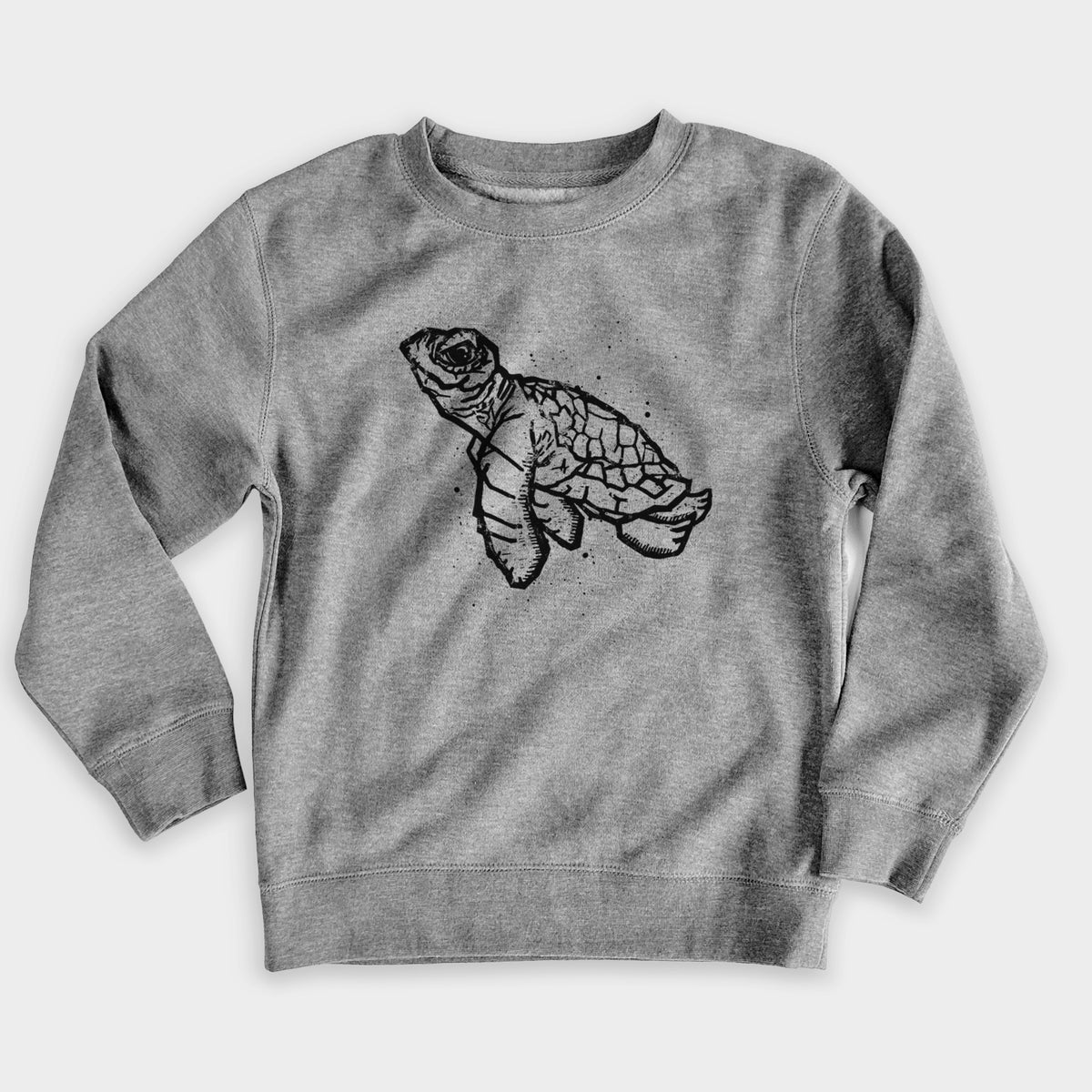 Nickel grey youth crewneck sweatshirt laid flat, printed with a black linocut-style illustration of a baby sea turtle with a patterned shell and ink splatters.