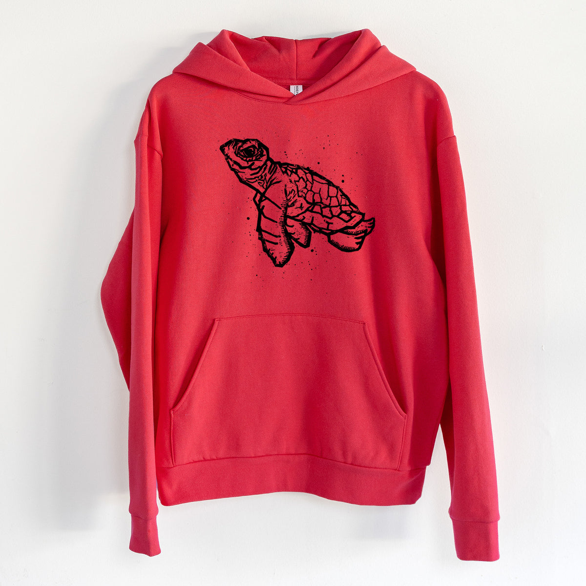 Baby Sea Turtle - Statement Midweight Hoodie in Cherry Red, hanging on a white wall, with a front kangaroo pocket and no drawcords.