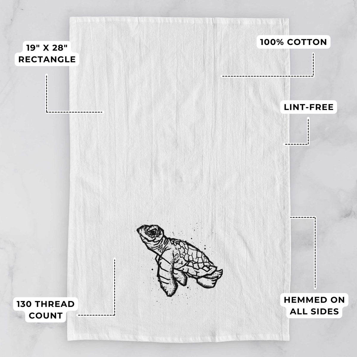 White tea towel printed with a black linocut-style illustration of a baby sea turtle with a patterned shell and ink splatters, with feature labels: 19 by 28 inch rectangle, 100% cotton, lint-free, 130 thread count, hemmed on all sides.