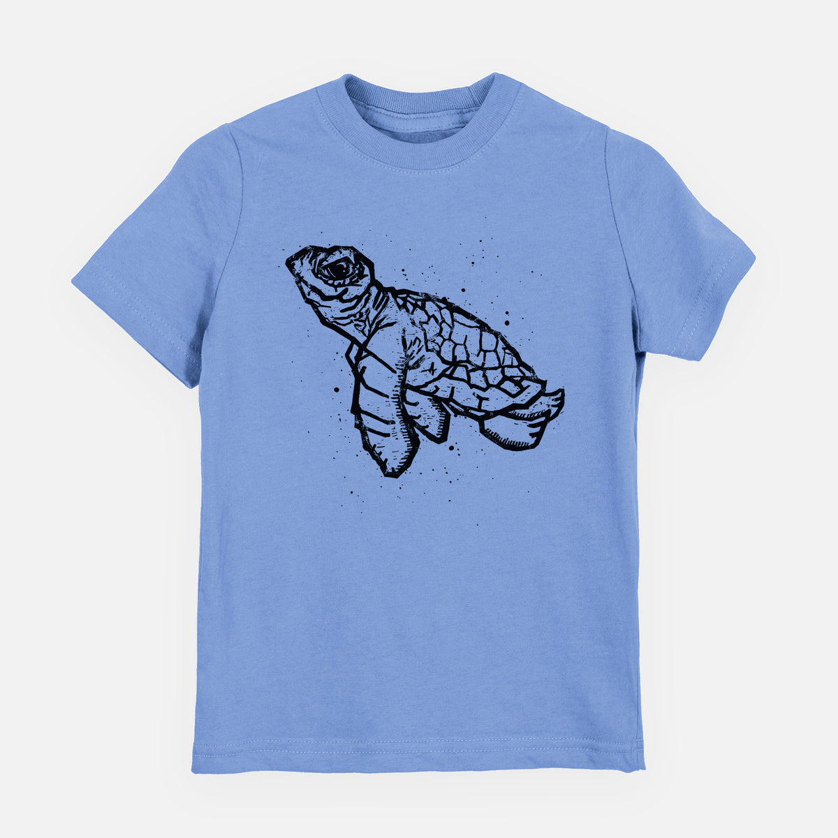 Carolina blue youth t-shirt laid flat, printed with a black linocut-style illustration of a baby sea turtle with a patterned shell and ink splatters.